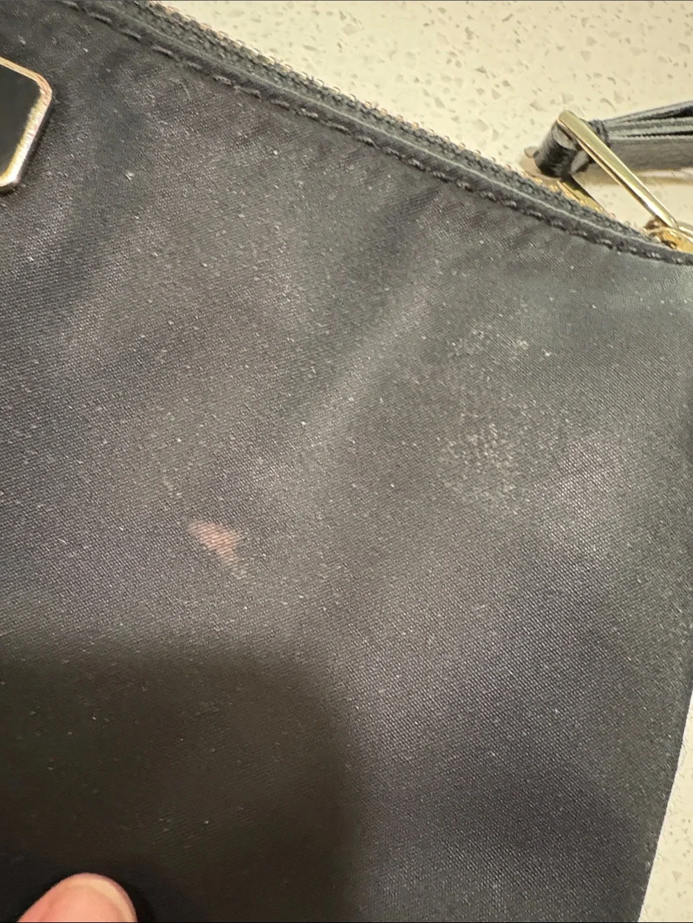 kate spade black crossbody pouch with gold-tone logo